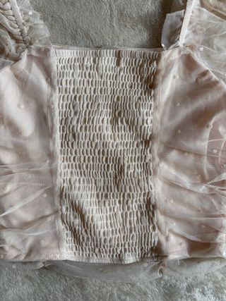 Top rosa empolvado con topos