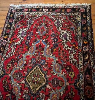 Alfombra persa antigua roja y negra