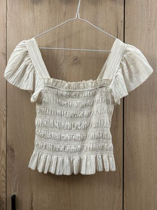 Top peplum marfil