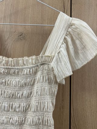 Top peplum marfil