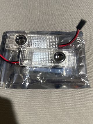 luces proyectores led puerta BMW