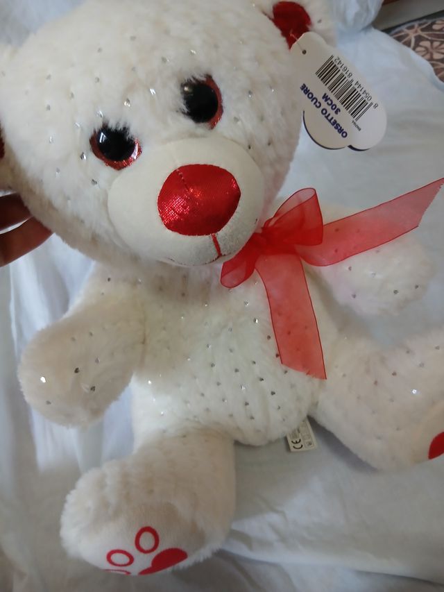 Orsetto bianco con paillettes e fiocco rosso