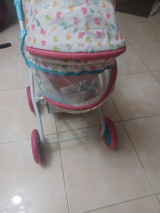 Carrito de muñecas rosa y blanco
