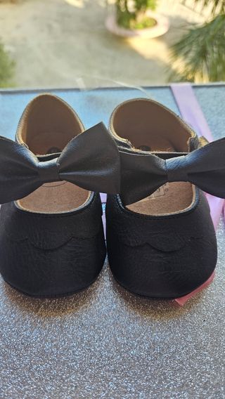 Scarpine neonata nere con fiocco