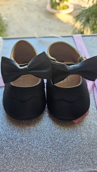 Scarpine neonata nere con fiocco