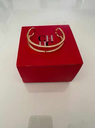 Pulsera Carolina Herrera Dorada