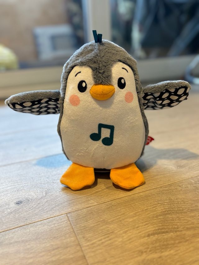 Pingüino musical de peluche suave Fisher Price