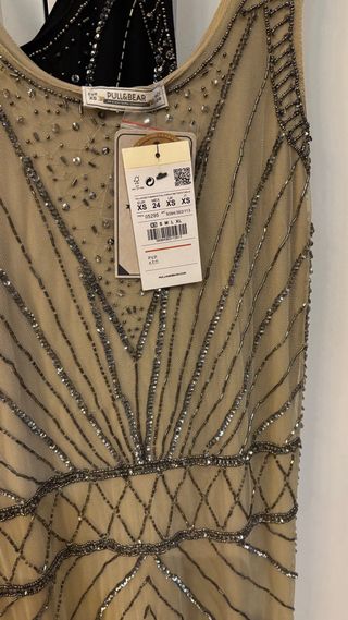 dos Vestidos joya beige y plateado  uno negro y ot