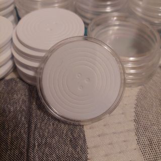 Cápsulas para monedas con almohadilla