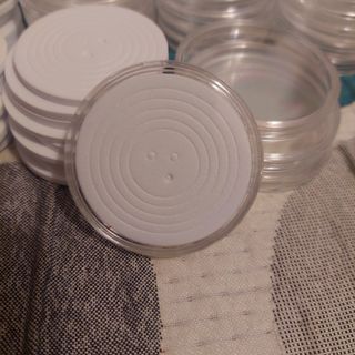 Cápsulas para monedas con almohadilla