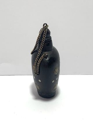 Snuff bottle orientale con motivi a stella