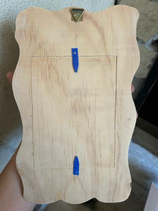 Portafoto in legno con cornice ondulata