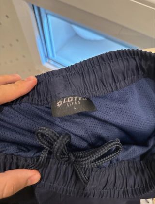 Conjunto deportivo Lotto azul y blanco