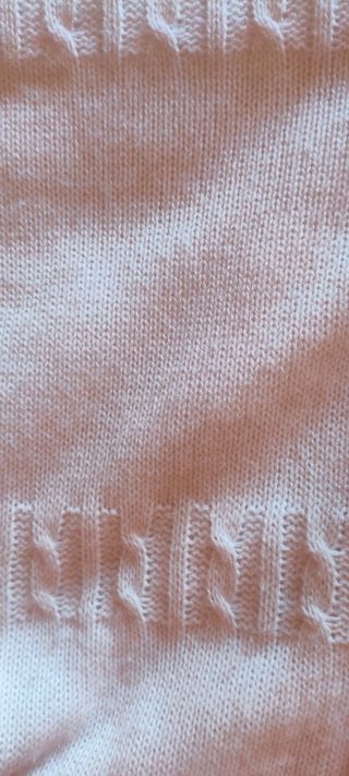 Saco bebé rosa con volantes