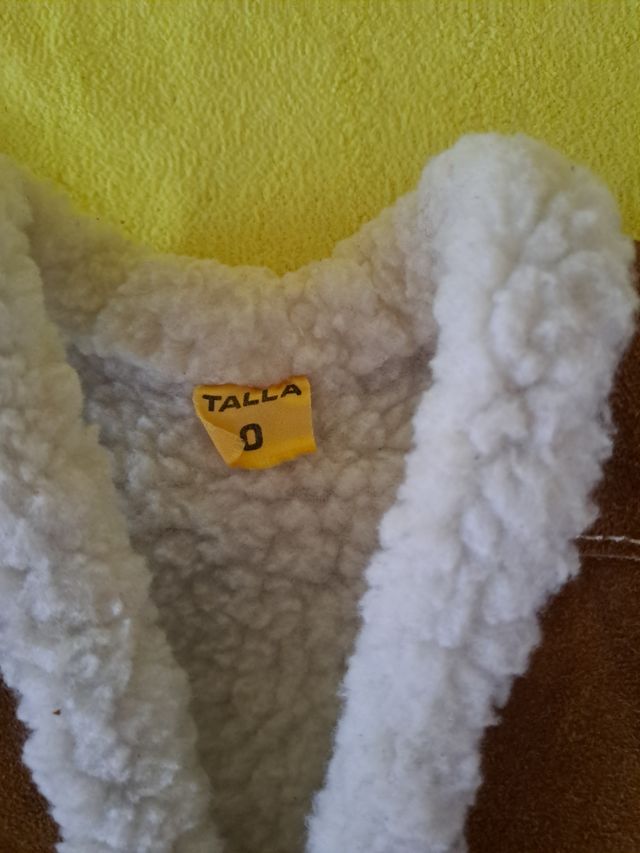 Gilet in finta pelle con pelliccia