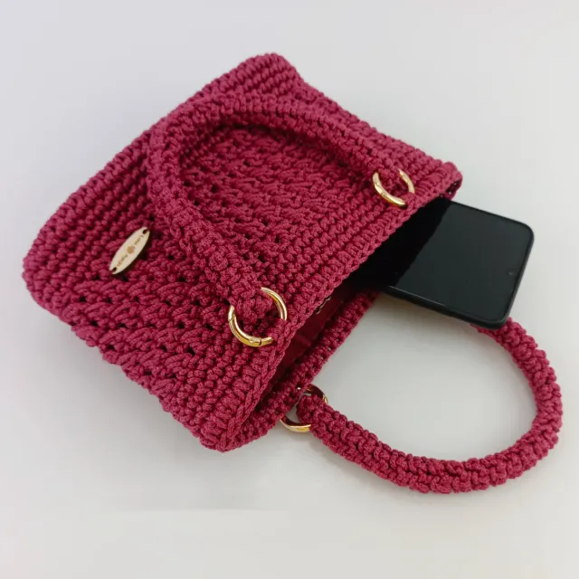 Bolso de mano tejido rosa oscuro