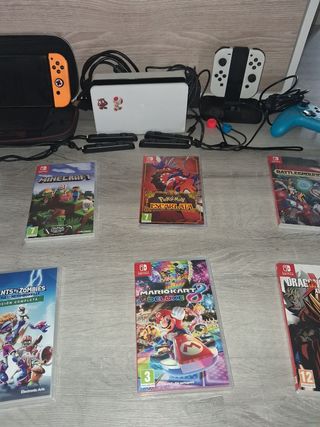 Nintendo Switch OLED White + Giochi e accessori