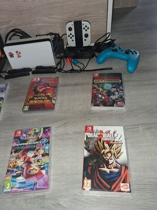 Nintendo Switch OLED White + Giochi e accessori