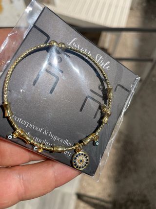 Pulsera Ojos Protectores Acero y Oro 18K