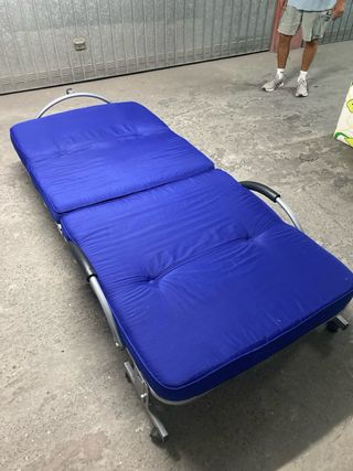 Cama plegable.
