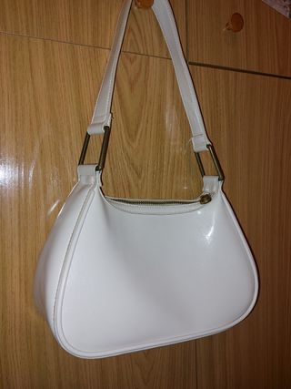 Bolso blanco moderno con cremallera dorada