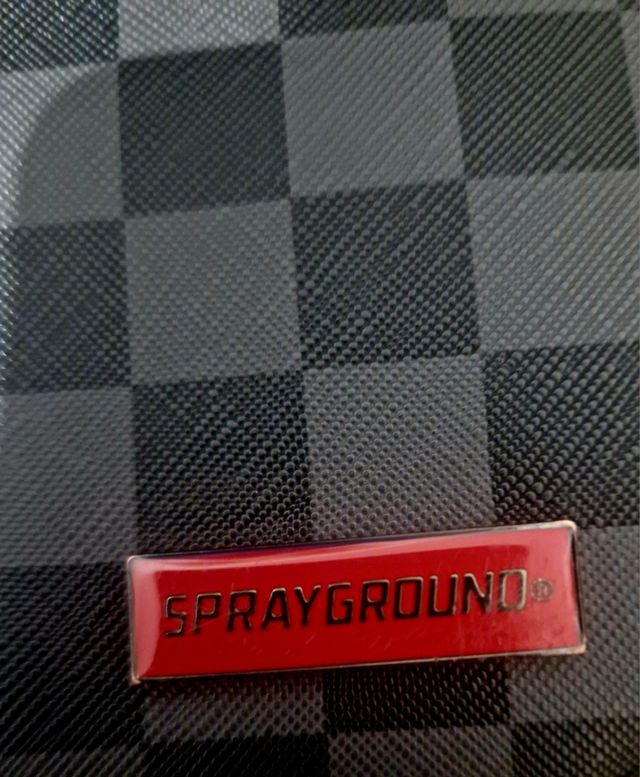 Poschette Sprayground a scacchi con squalo