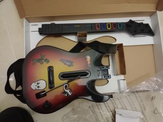 Consola PS2 con 9 juegos y 2 guitarras 
