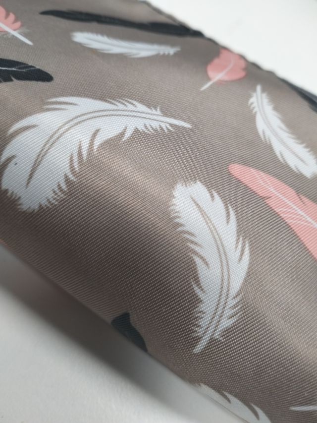 Neceser estampado plumas textura de tela plástica