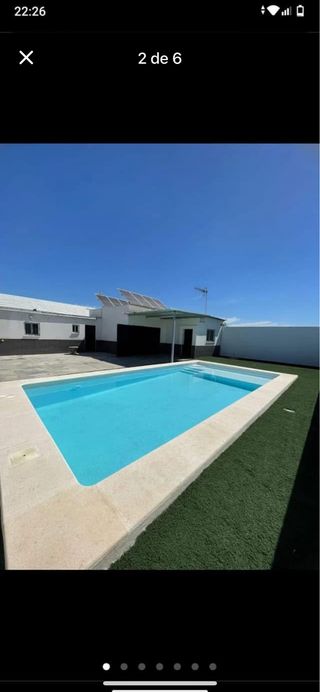 Parcela con nave y piscina en venta