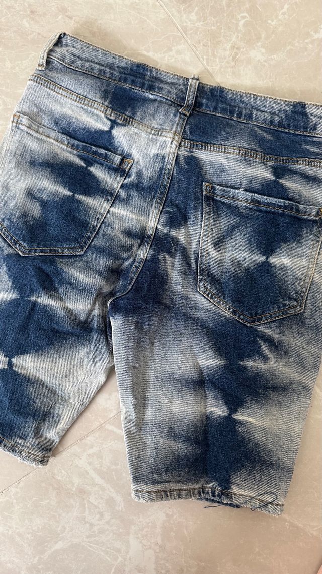 Pantaloncini jeans strappati uomo