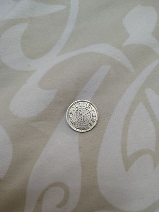 Moneda antigua con diseño
