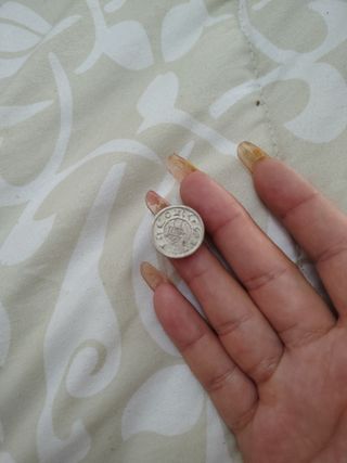 Moneda antigua con diseño