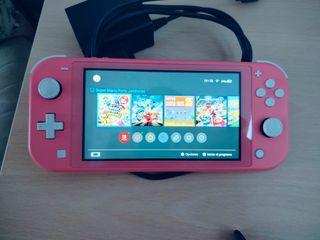 Nintendo Switch Lite Coral + Funda