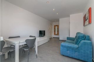 Muebles salón comedor y sofá azul