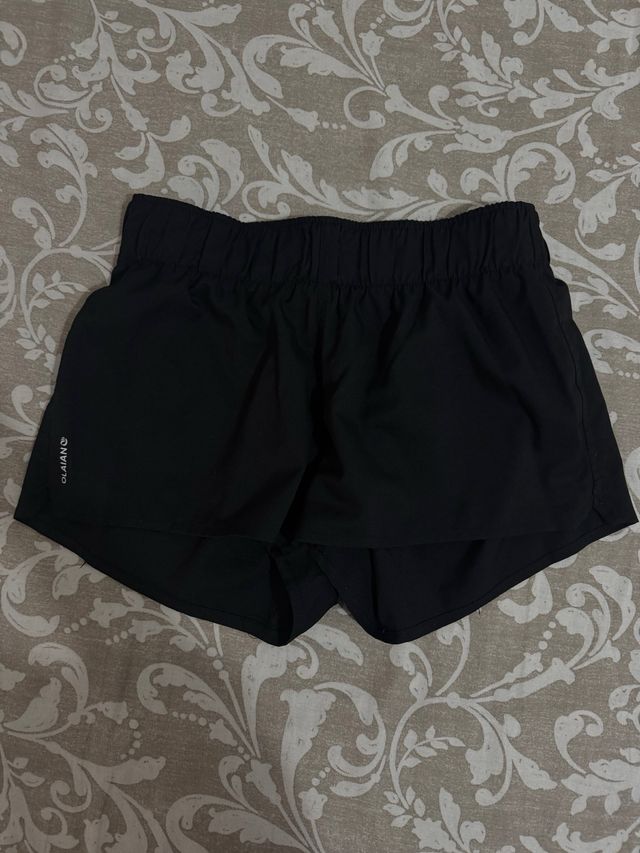 Pantalón corto deportivo Olaian negro
