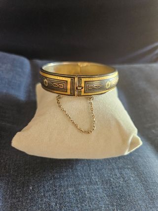 Bracciale rigido con decorazioni oro e nero