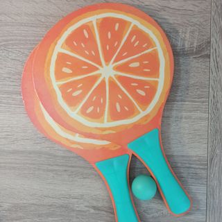 Raquetas de playa con diseño de naranja
