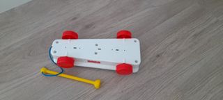 Xilófono Fisher-Price con baqueta.