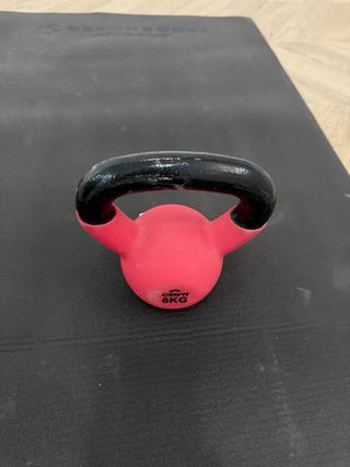 Esterilla, pesa y pelota de ejercicio