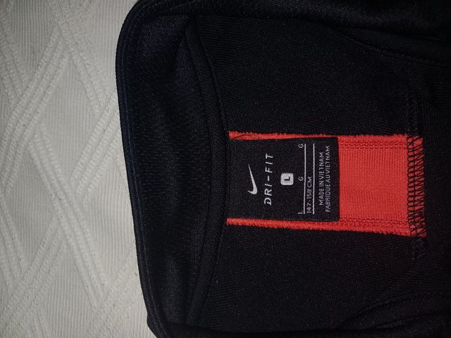 Sudadera Nike Negra con franja naranja,toda...