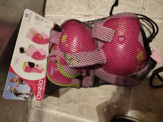 Patines rosas  32-34 Oxelo, casco y protecciónes 