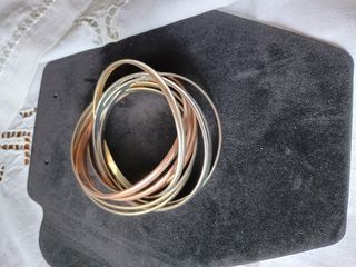 Braccialetti rigidi color oro e argento