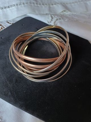 Braccialetti rigidi color oro e argento