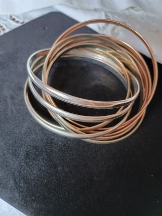 Braccialetti rigidi color oro e argento
