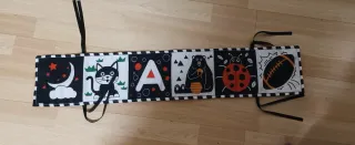 Piano Baby Einstein y libro tela alto contrastr