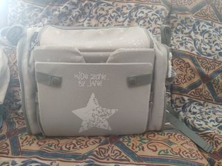 Asiento elevador convertible en bolso Jané