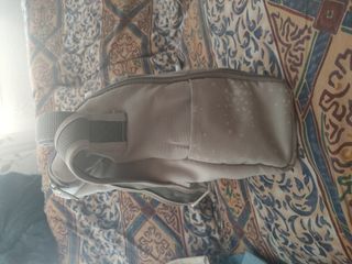 Asiento elevador convertible en bolso Jané