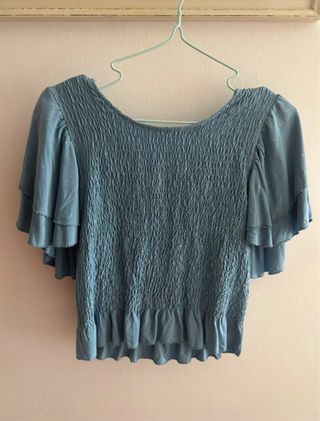 Blusa azul con destellos dorados