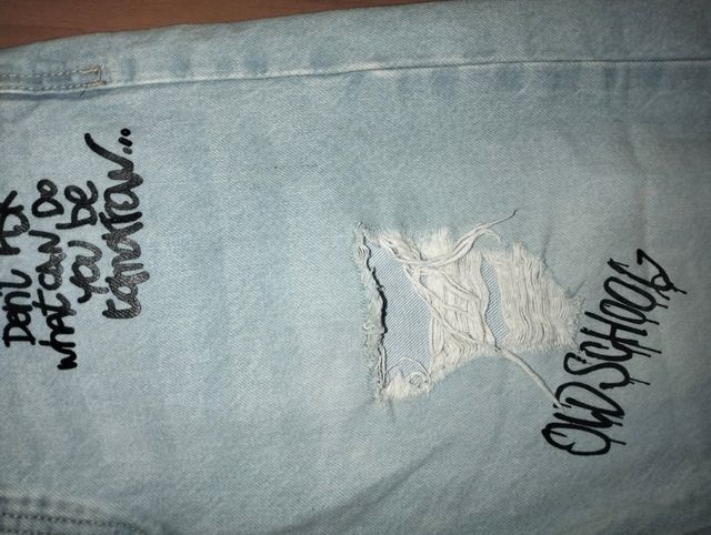 Jeans Terra strappati con scritte