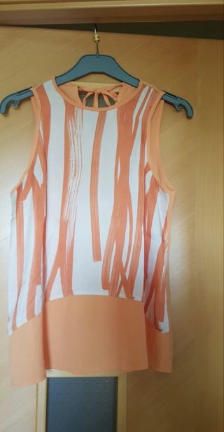 Blusa sin mangas naranja y blanca